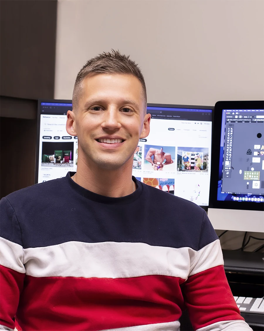 Tom Adolphs seated in a design workspace.