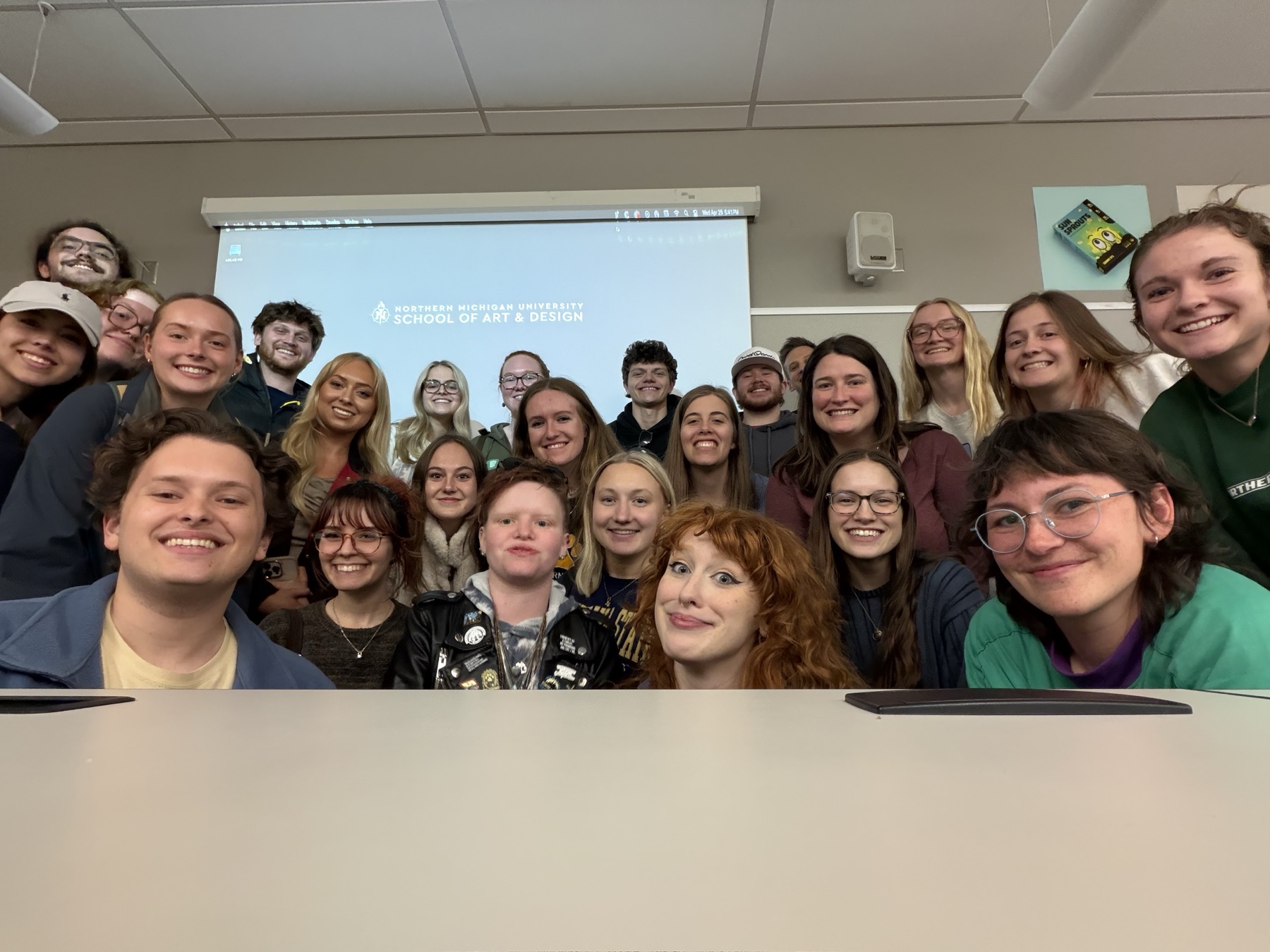 AD488 class group photo in a design classroom.