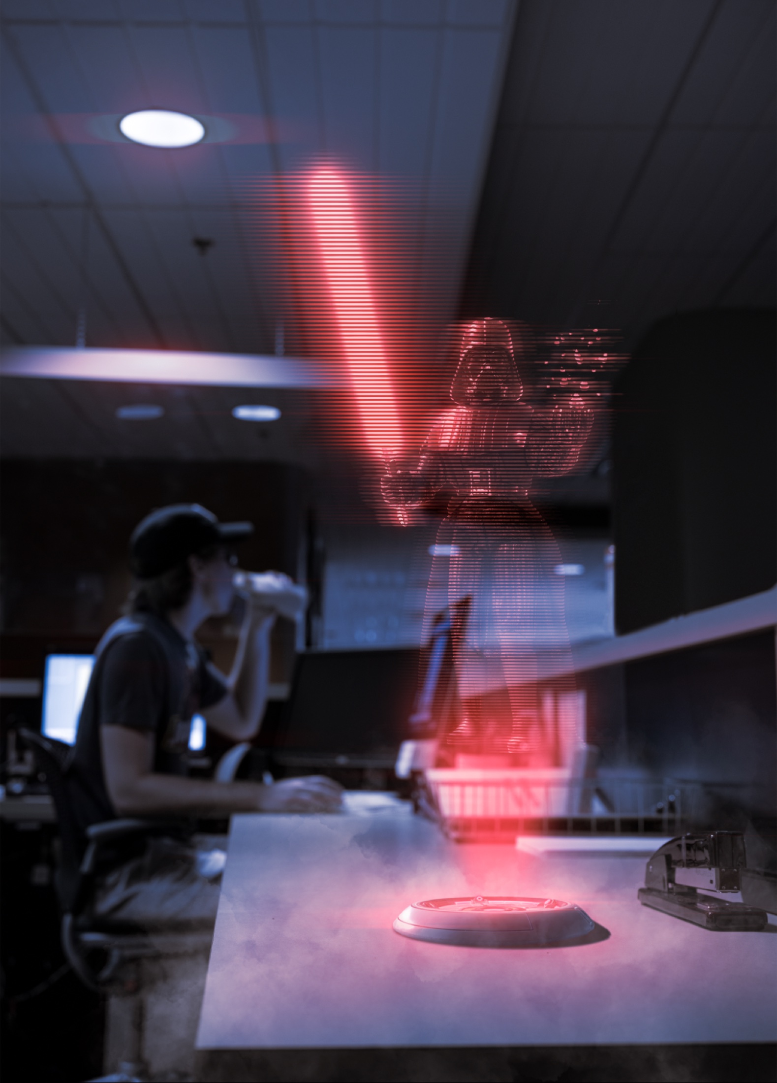 A red holographic figure holding a glowing sword in a dim classroom.